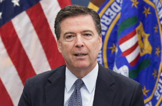 James Comey with flags (Public Domain FBI photo)