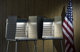 Empty voting booths (Shutterstock)