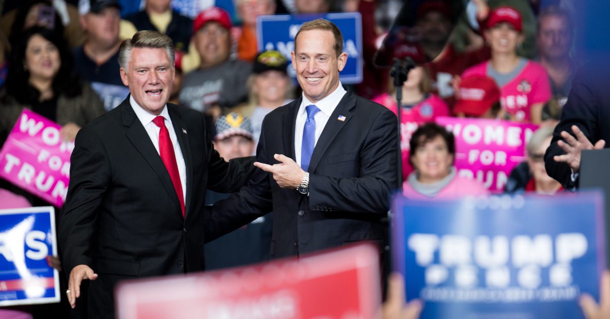 CHARLOTTE, NC - OCTOBER 26: Republican Congressional candidate for North Carolina's 13th district Ted Budd (R), and 9th district Mark Harris (L) are introduced by President Donald Trump during a campaign rally at the Bojangles Coliseum on October 26, 2018 in Charlotte, North Carolina. President Trump visited Charlotte to campaign for 9th District House candidate Mark Harris. 