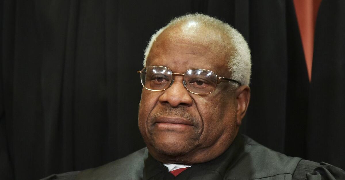 Associate Justice Clarence Thomas poses for the official group photo at the US Supreme Court in Washington, DC on November 30, 2018.