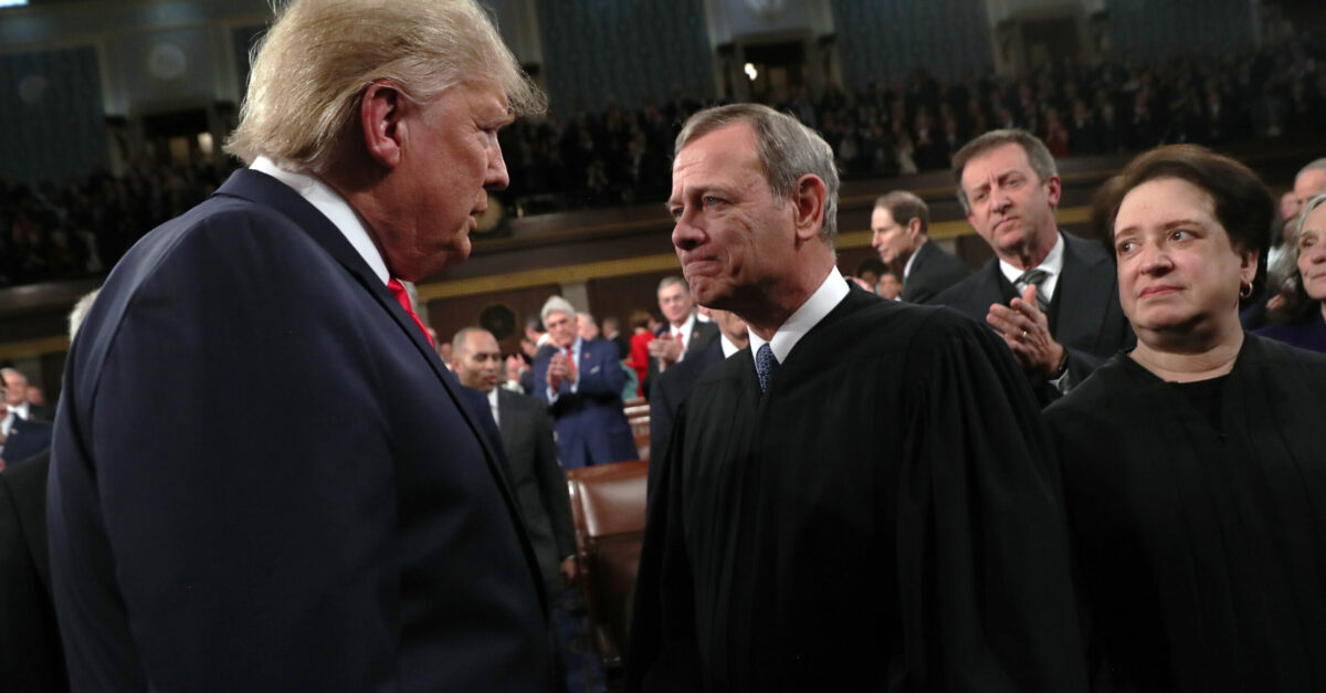 WASHINGTON, DC - FEBRUARY 04: U.S. President Donald Trump talks with Supreme Court Chief Justice John Roberts as Associate Justice Elena Kagan looks on before the State of the Union address in the House chamber on February 4, 2020 in Washington, DC. Trump is delivering his third State of the Union address on the night before the U.S. Senate is set to vote in his impeachment trial.