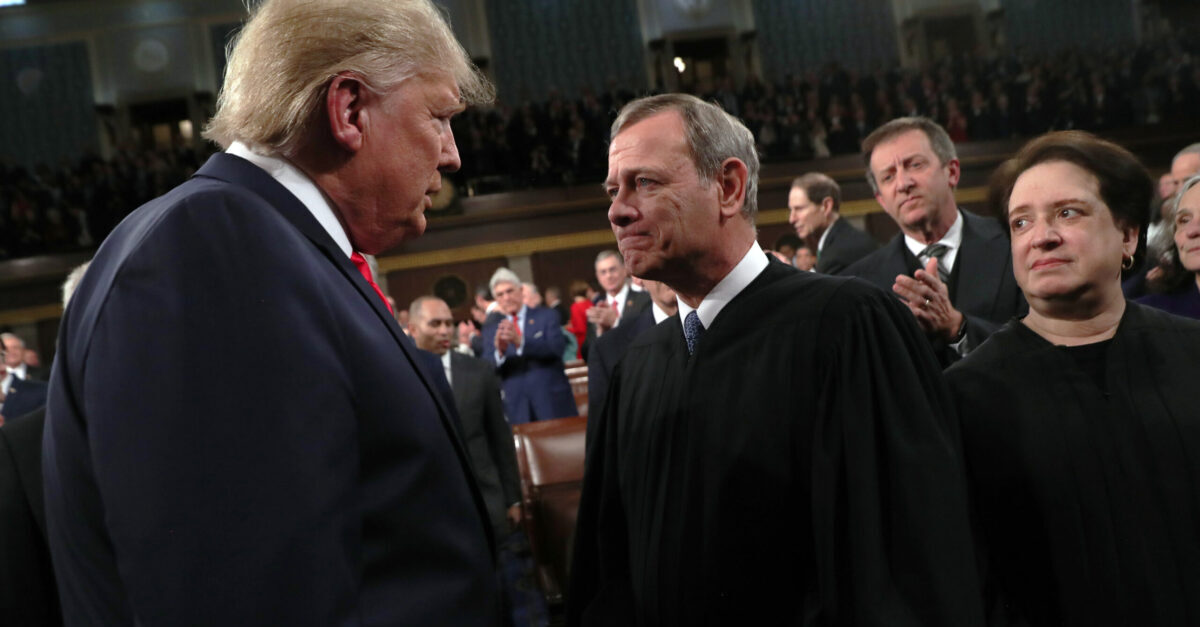 WASHINGTON, DC - FEBRUARY 04: U.S. President Donald Trump talks with Supreme Court Chief Justice John Roberts as Associate Justice Elena Kagan looks on before the State of the Union address in the House chamber on February 4, 2020 in Washington, DC. Trump is delivering his third State of the Union address on the night before the U.S. Senate is set to vote in his impeachment trial. 