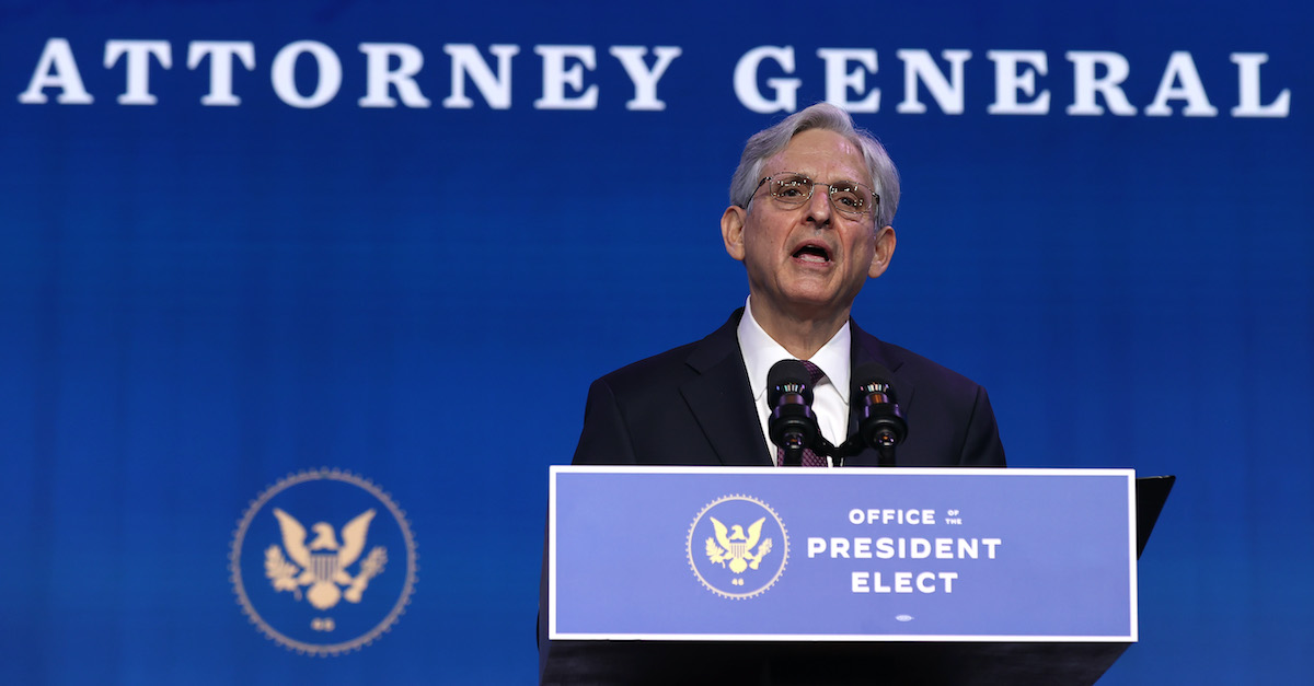 AG Merric Garland speaking at podium.