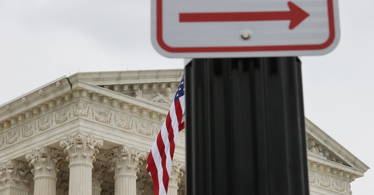The U.S. Supreme Court offset against a right arrow sign