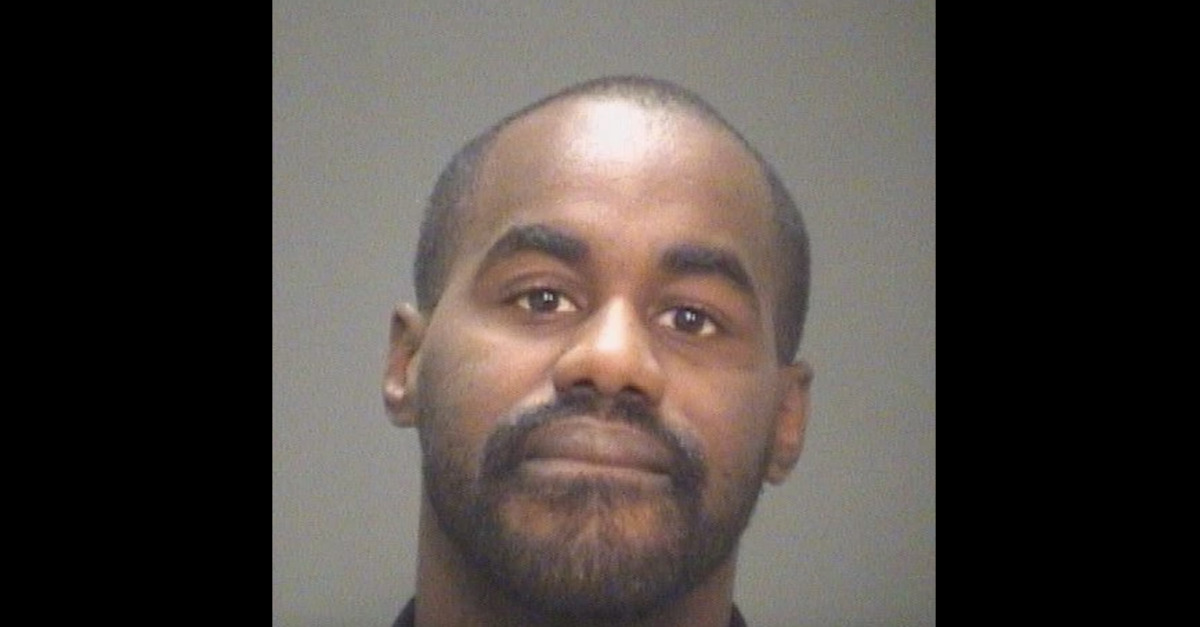 Cornelius Pames appears in a mugshot