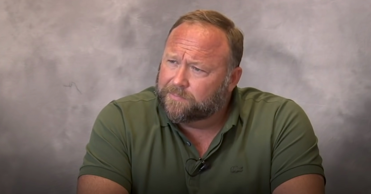 Alex Jones appears in a freeze frame extracted from a deposition video. The recording was posted to YouTube by the online news outlet HuffPost.