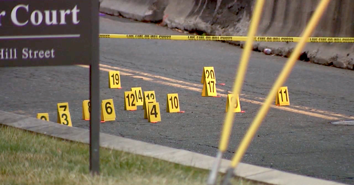 Evidence flags were positioned on Golden Hill Street in Bridgeport, Conn., in front of a state superior courthouse after several victims were shot multiple times on Jan. 27, 2020. (Image via screengrab from WTNH-TV.)
