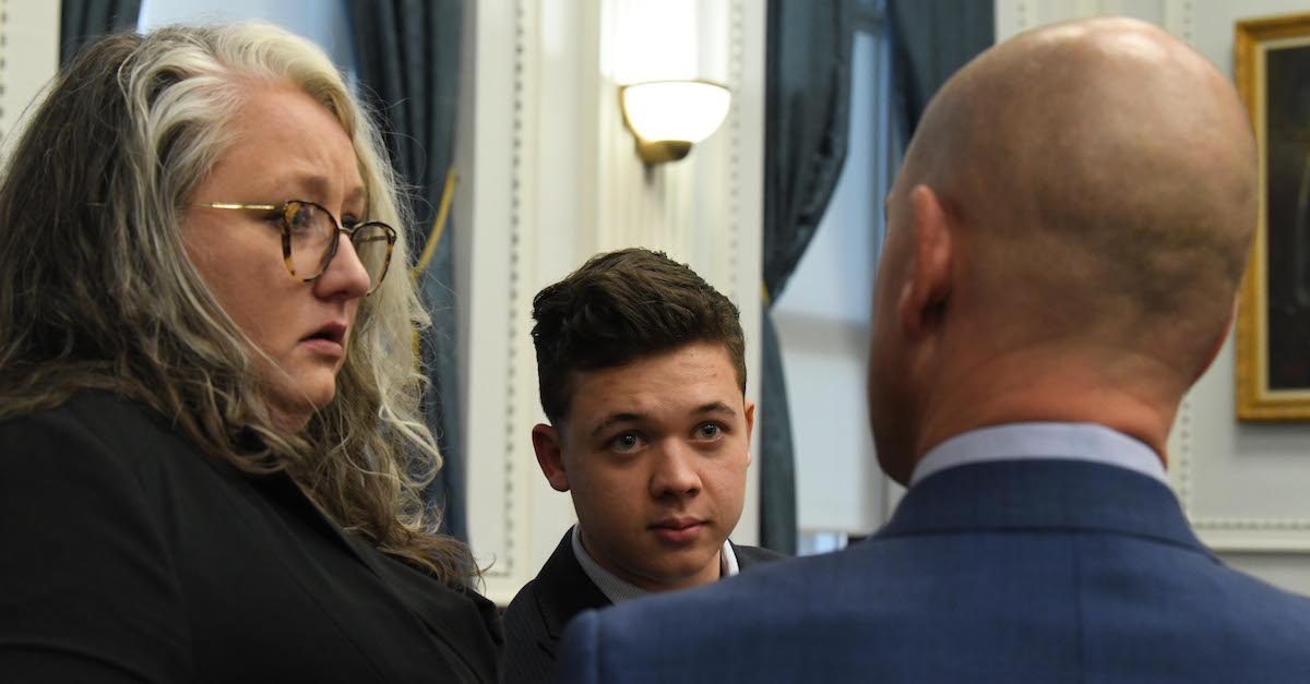 Defense attorneys Natalie Wisco and Corey Chirafisi speak with Kyle Rittenhouse on Fri., Nov. 5, 2021, at the conclusion of the first week of testimony. (Image © Mark Hertzberg/Zuma Press Wire/Pool)