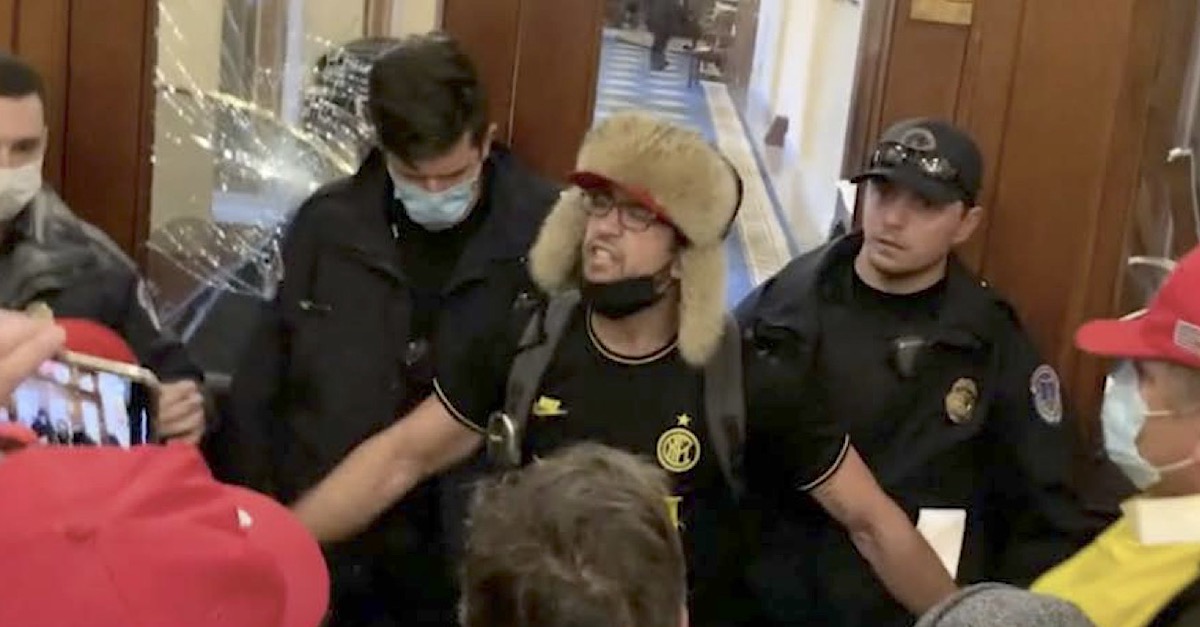 Zachary Alam (center, fur-lined hat) appears near where Ashli Babbitt was shot in an image taken from an FBI affidavit.