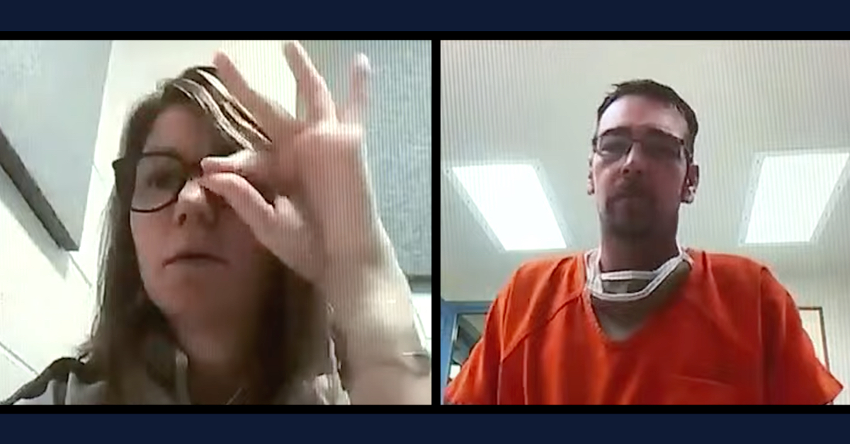 Jennifer and James Crumbley appeared to attempt to communicate by mouthing words and hand signals to one another during a court hearing on Jan. 7, 2022.
