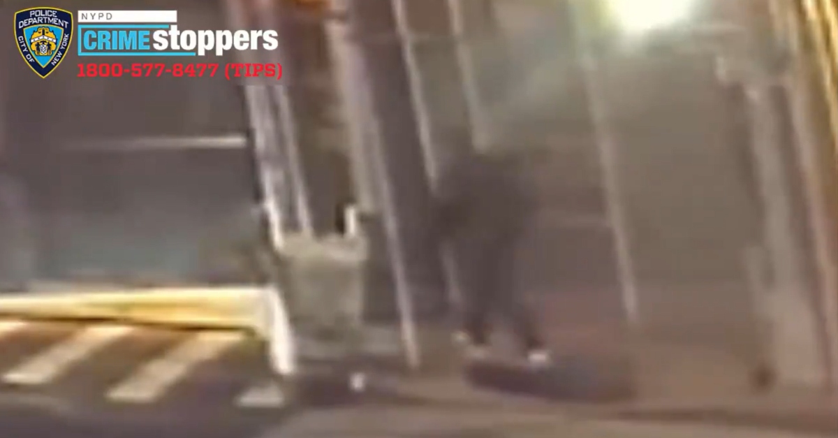 Screenshot of man identified as Jarrod Powell walks away after attacking Yao Pan Ma via NYPD.