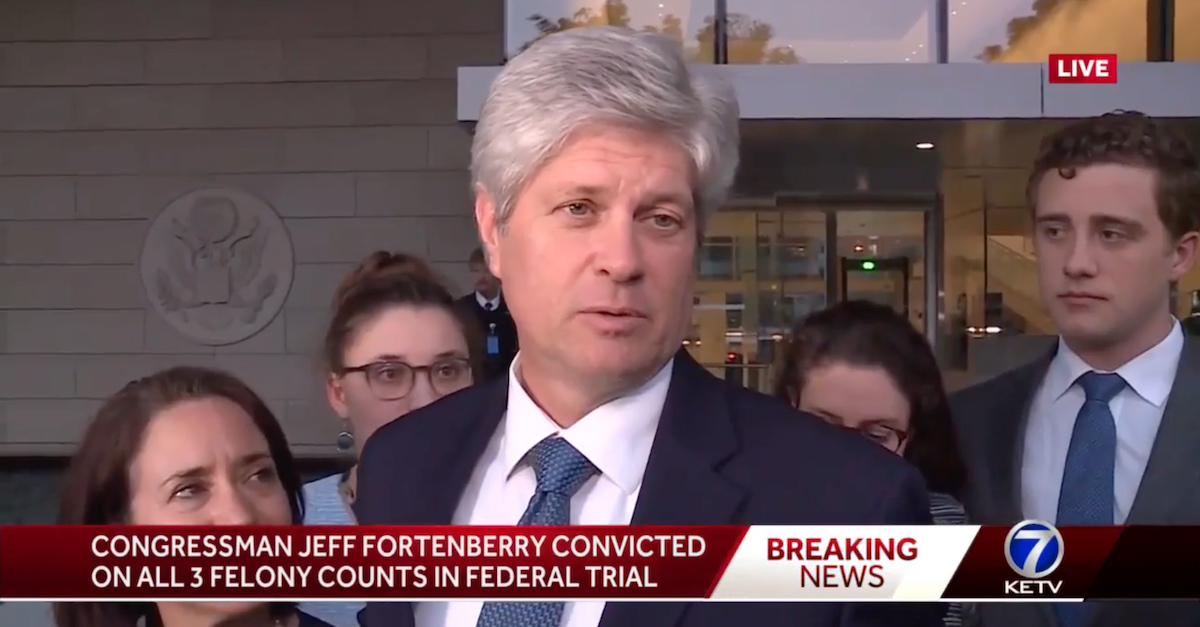 Jeff Fortenberry was surrounded by his wife (left) and some of his children during a press gaggle outside federal court in California.