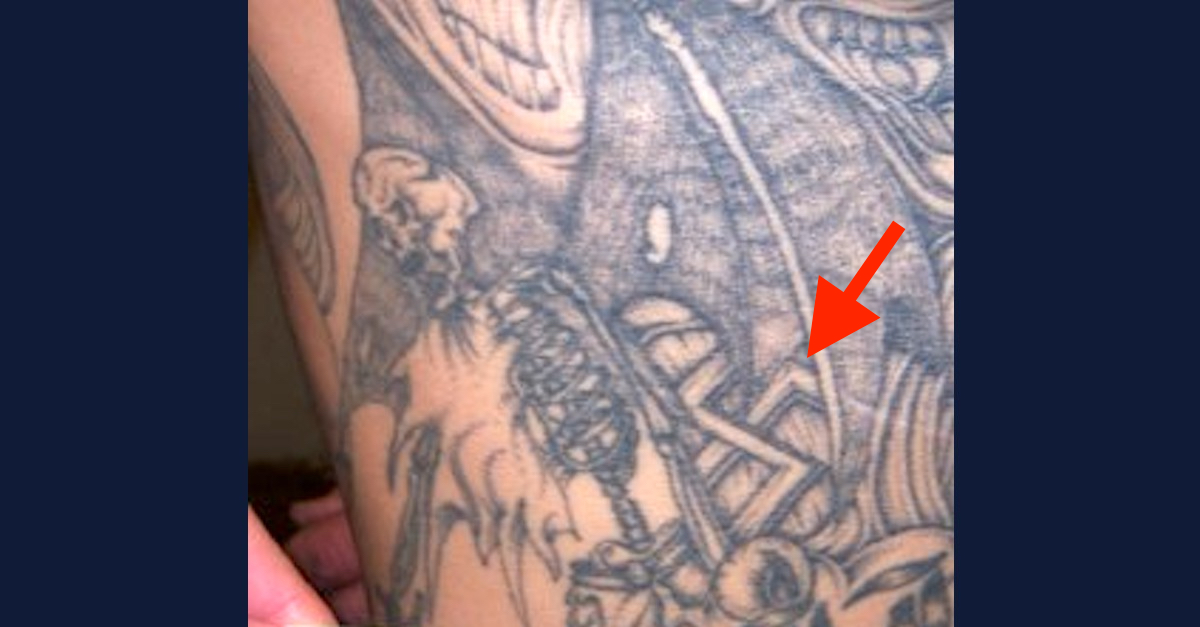 One of Jeremy Wayne Jones's alleged tattoos contains a swastika. Law&Crime has added an arrow to the image to point it out. (Image via the San Joaquin County District Attorney's Office.)