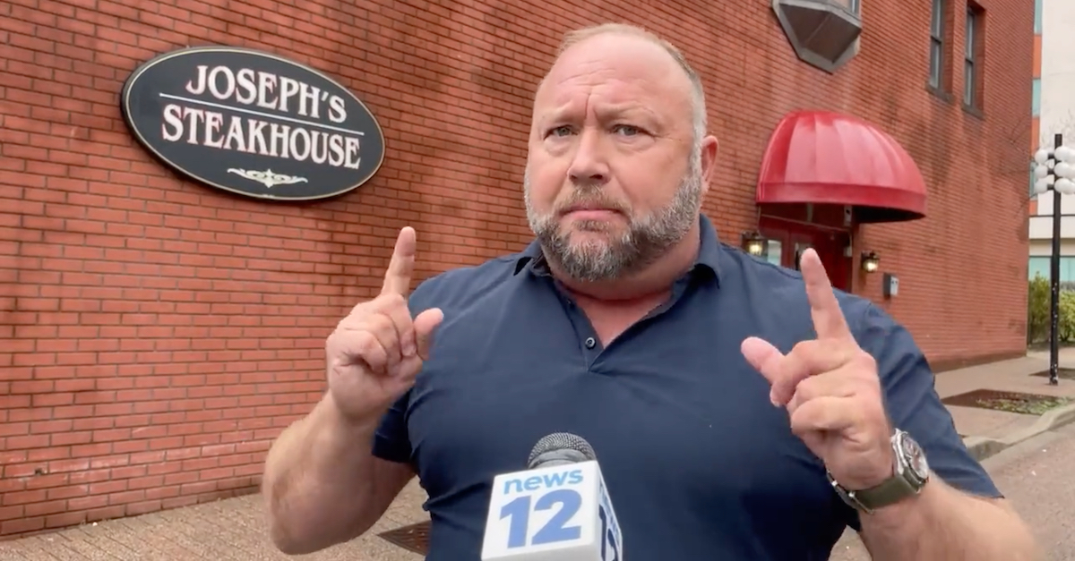 Alex Jones spoke to a local reporter from News12 Connecticut while on an apparent lunch break during a multi-day deposition in Bridgeport, Conn., on April 6, 2022. (Image via News12/Twitter video screengrab.)