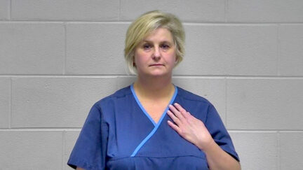 Dr. Stephanie M. Russell appears in an Oldham County Detention Center mugshot.