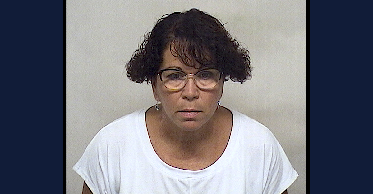 A police booking photo shows Chrystal Collins.