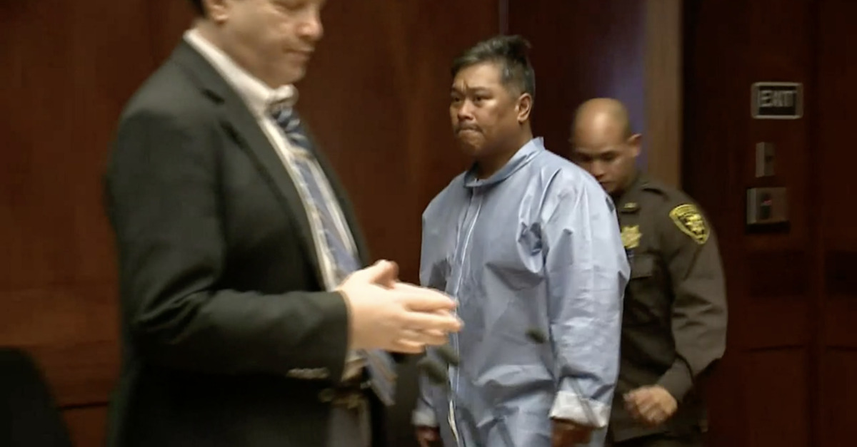 Richard Obrero walks into a courtroom