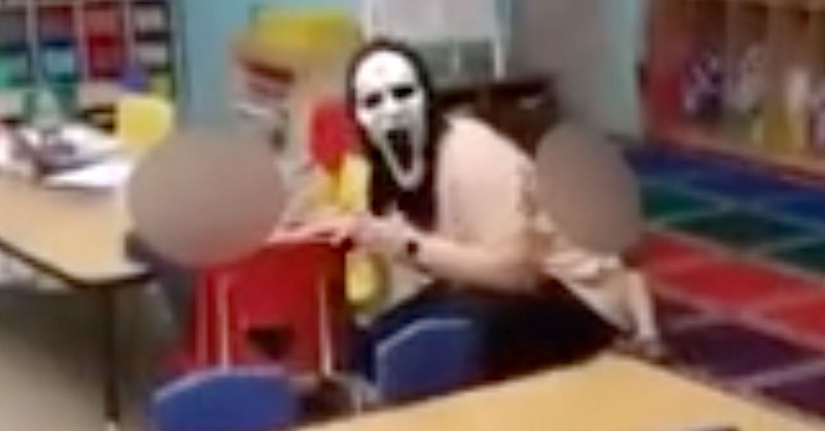 A photo shows a daycare worker wearing a mask.