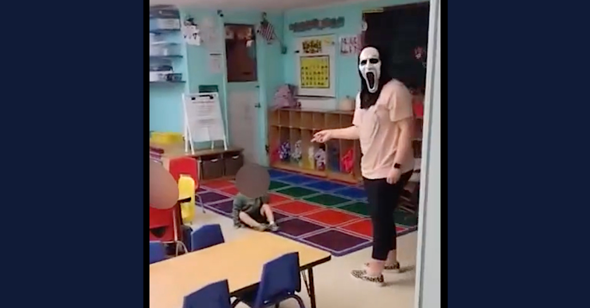 A photo shows a daycare worker wearing a mask.