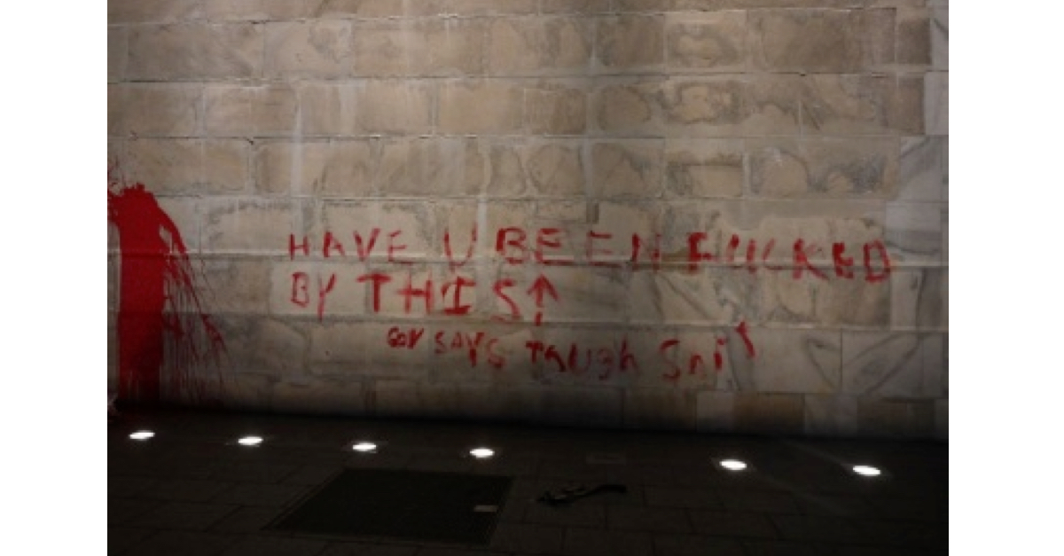 Red paint on the Washington Monument spells out: "Have U been fucked by this. Gov says tough shit."