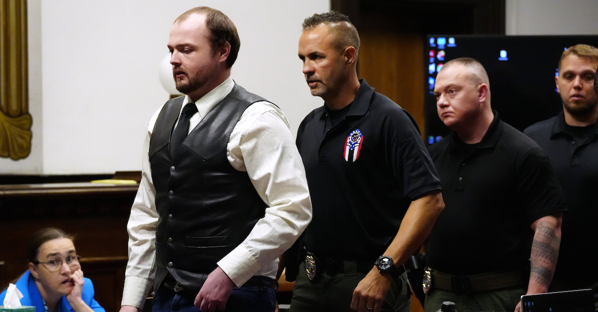 A photo shows George Wagner IV being led out of court.
