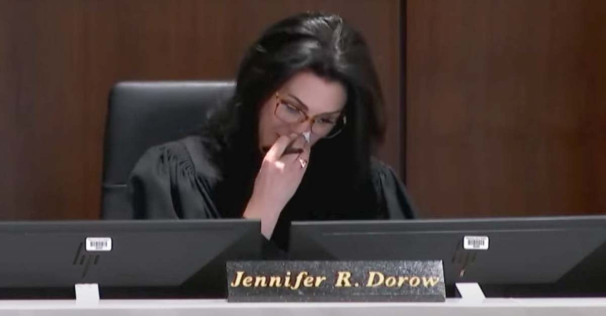A photo shows Judge Jennifer Dorow dabbing her face with a tissue.