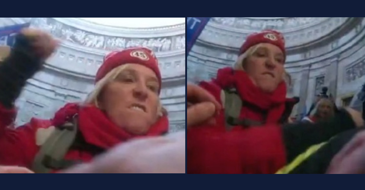 Jacquelyn Starer has blond hair and is wearing a red knit hat and red scarf. She is seen apparently using her right hand to strike a police officer inside the U.S. Capitol.