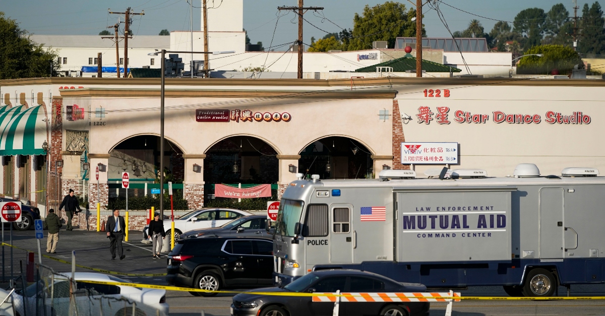 Investigators are seen outside Star Dance Studio in Monterey Park, Calif., Sunday, Jan. 22, 2023. A mass shooting took place at the dance club following a Lunar New Year celebration, setting off a manhunt for the suspect. (AP Photo/Jae C. Hong)