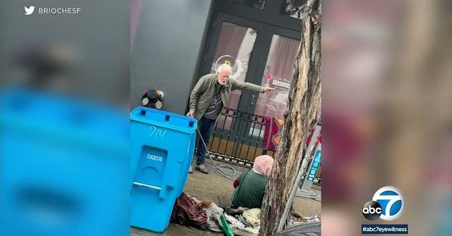 A San Francisco art gallery owner faces charges after he was seen in a video spraying a homeless woman with a hose on Monday, Jan. 9, 2023. (Screenshot from ABC7)