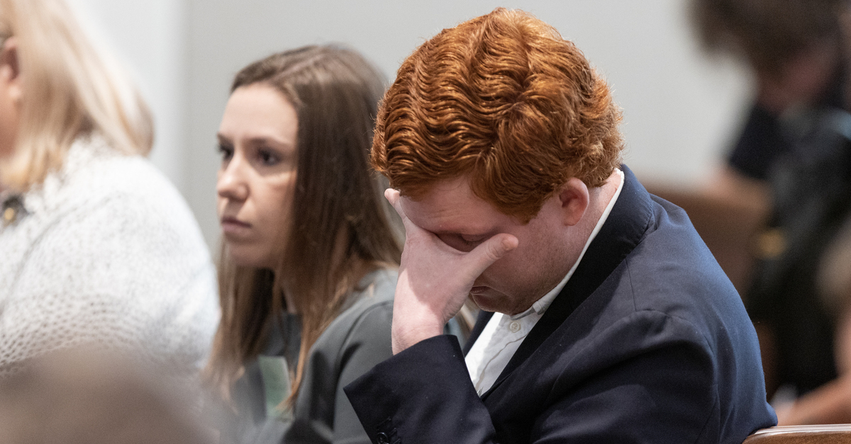 Buster Murdaugh, right, the son of Alex Murdaugh, listens to a