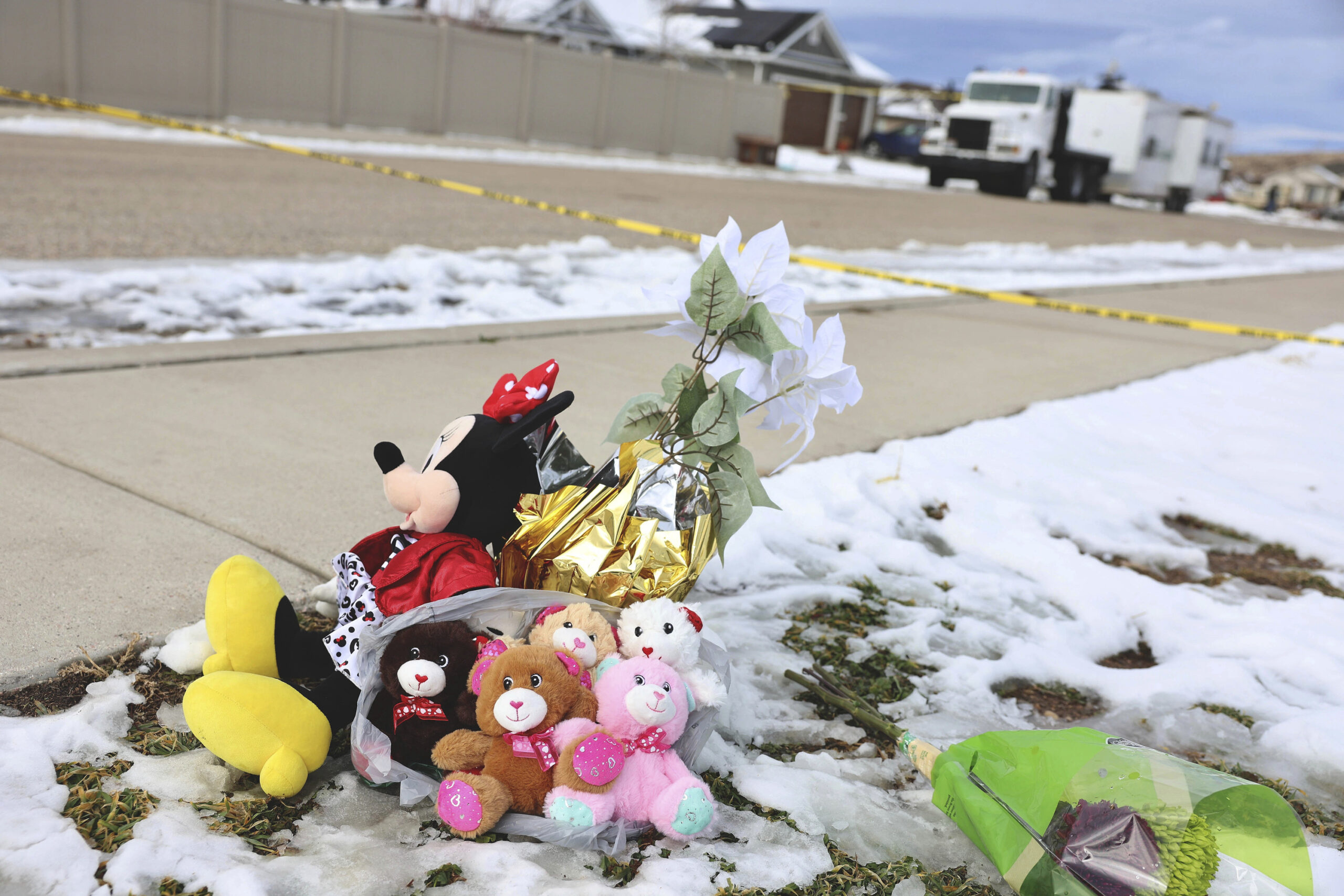 Five stuffed animals left by the the Enoch Elementary School PTA are pictured at a makeshift memorial near the police tape at a home where eight members of a family were killed in Enoch, Utah, on Jan. 5, 2023. (AP)