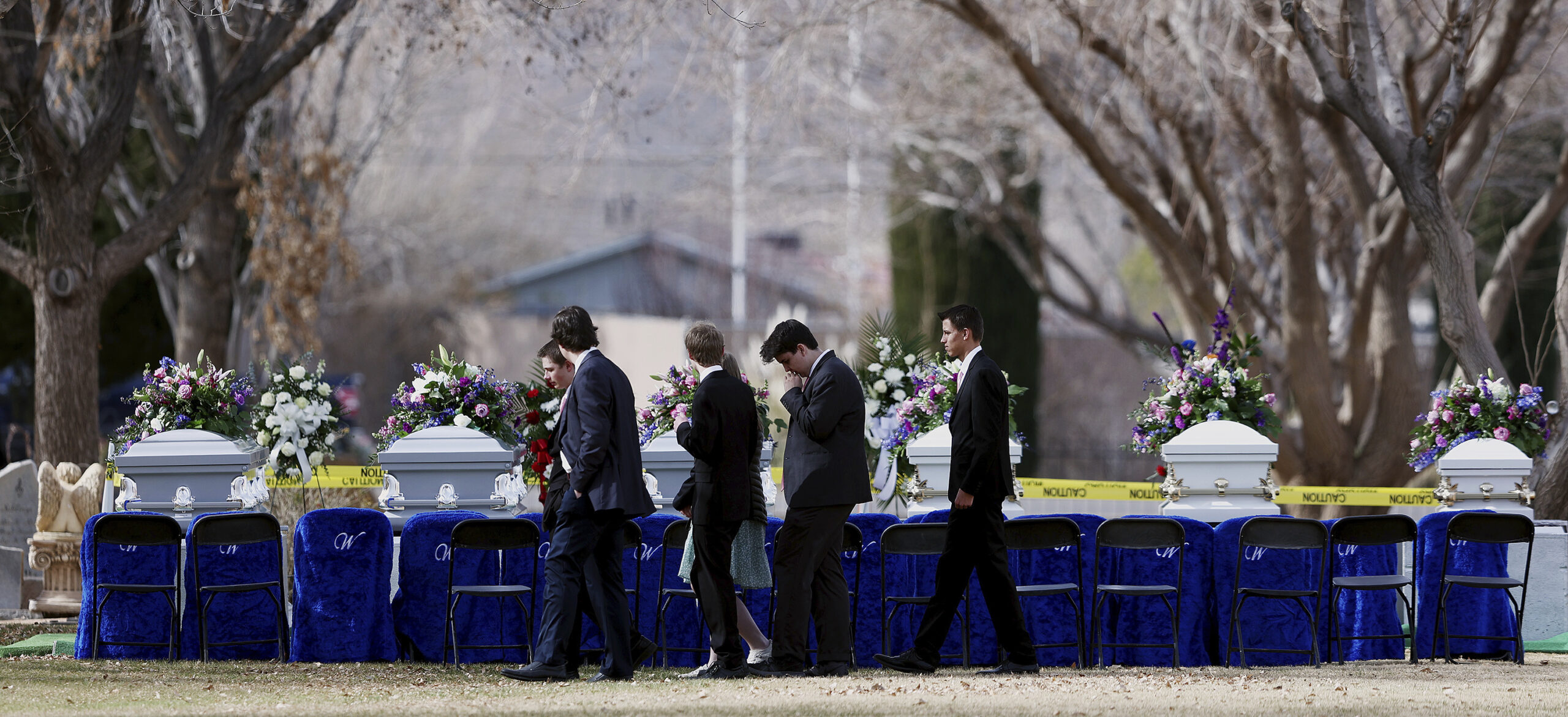 A group of young people walk away following graveside services of the Haight and Earl families, on Jan. 13, 2023, in La Verkin, Utah. (AP)