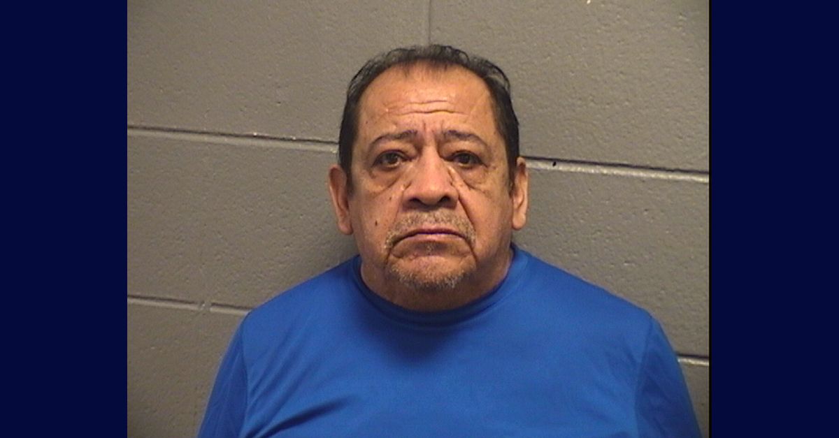 Jose Alvarez appears in a mugshot