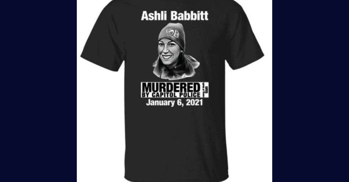 Peter Navarro's attorney Stanley Woodward argues in a motion requesting a new trial after his client's two-count conviction for contempt of Congress that at least one protester wearing this t-shirt outside of the courthouse while jurors were nearby on a break, unduly influenced the trial outcome. Ashli Babbitt died on Jan. 6 after she attempted to climb through a shattered window in the Speaker's Lobby during the rioting while disregarding multiple commands to stand down. 