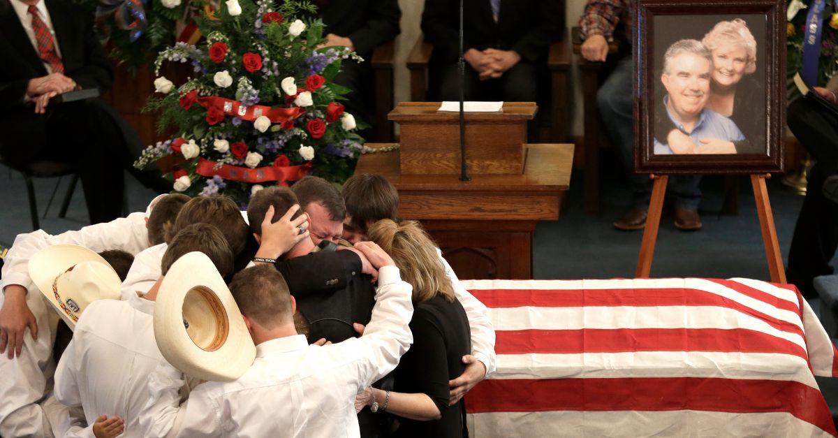 The family of Kaufman County District Attorney Mike McLelland and his wife, Cynthia, comfort each other during their funeral services at the First Baptist Church of Wortham Friday, April 5, 2013, in Wortham, Texas. The couple was found shot to death in their house near Forney, about 20 miles east of Dallas. (AP Photo/LM Otero, File)