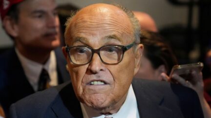 Rudy Giuliani speaks to reporters after Republican presidential candidate former President Donald Trump spoke at a primary election night party in Nashua, N.H., Tuesday, Jan. 23, 2024. (AP Photo/Matt Rourke)