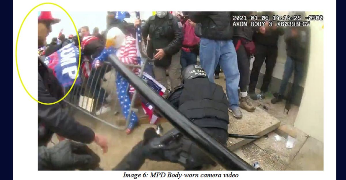 Metropolitan Police Department body camera footage shows Jason Farris, circled in yellow, moments after pushing officer to ground at Capitol on Jan. 6, 2021. Courtesy U.S. Department of Justice.