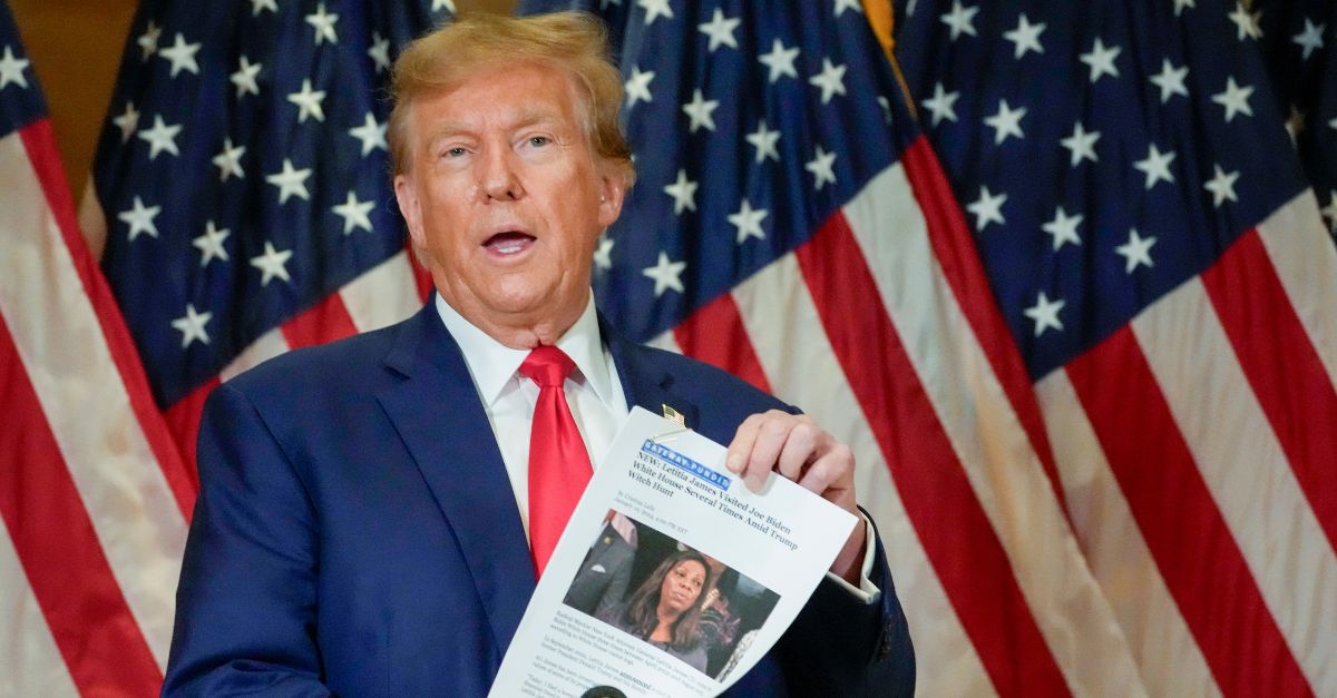 FILE - Former President Donald Trump holds up a copy of a story featuring New York Attorney General Letitia James while speaking during a news conference, Jan. 11, 2024, in New York. (AP Photo/Mary Altaffer, File)