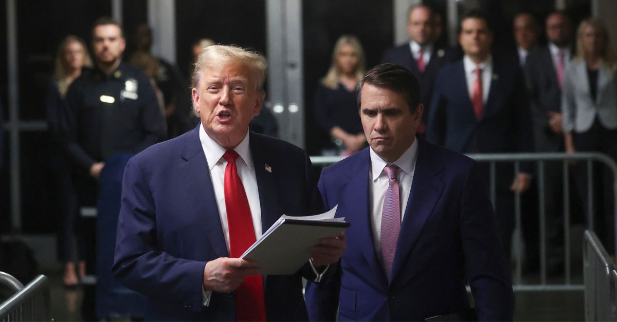 Former President Donald Trump speaks to the media, while his lawyer Todd Blanche listens, after the day's court session for his trial at Manhattan criminal court, Thursday, May 16, 2024, in New York. (Mike Segar/Pool Photo via AP) 