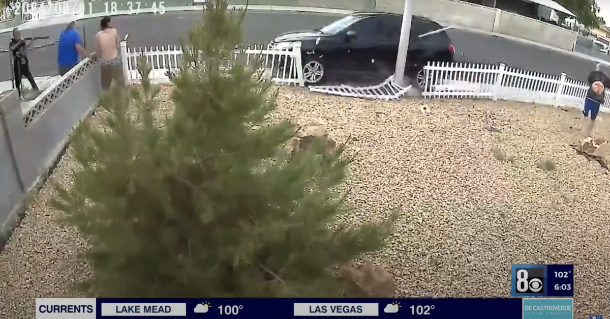 A man fires a shotgun at an SUV driver intent on running down pedestrians in Las Vegas.