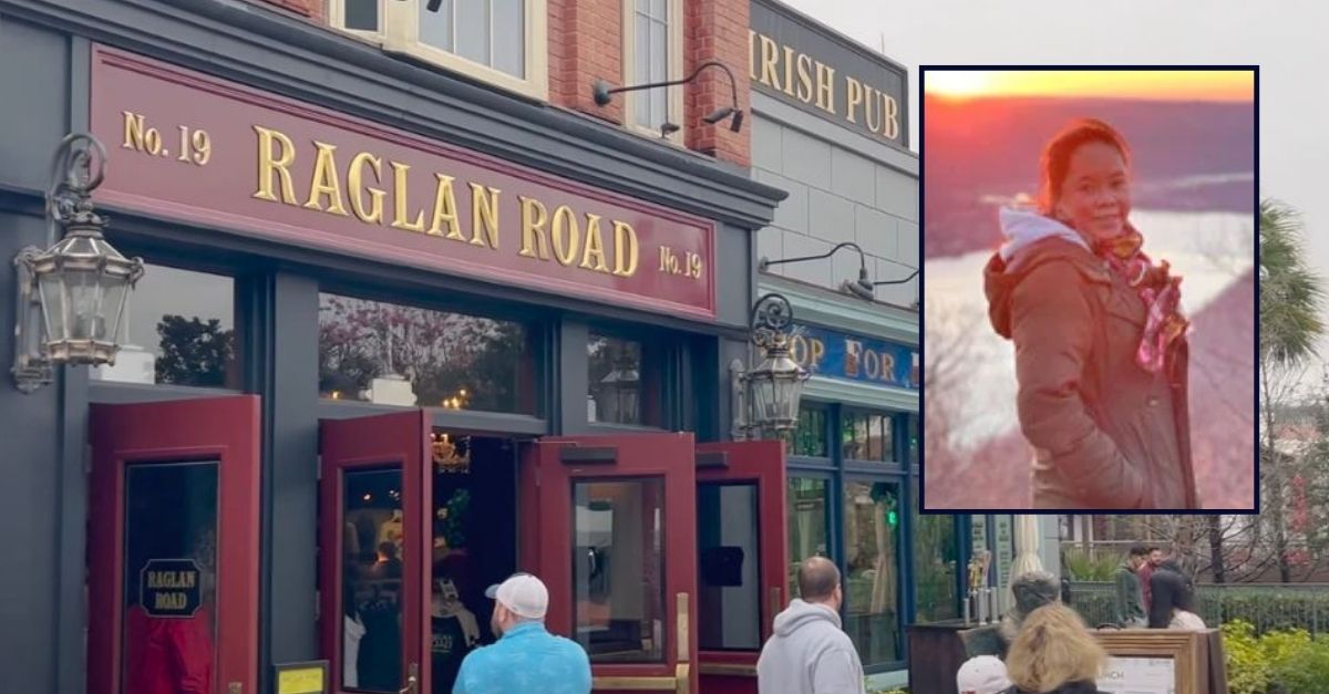 Dr. Kanokporn Tangsuan is seen in front of a picture of the Raglan Road Irish Pub and Restaurant.