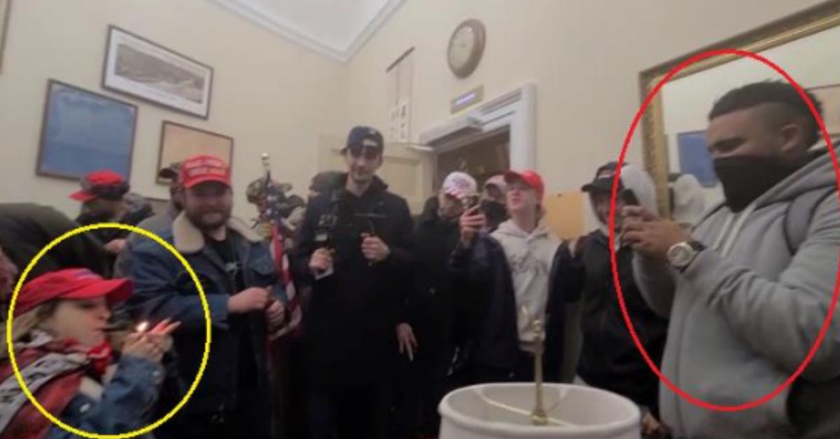  Celena Belton (circled in yellow) lighting and smoking an object while Bennett Blair (circled in red) appears to be filming or using his phone (Dept. of Justice court filing).