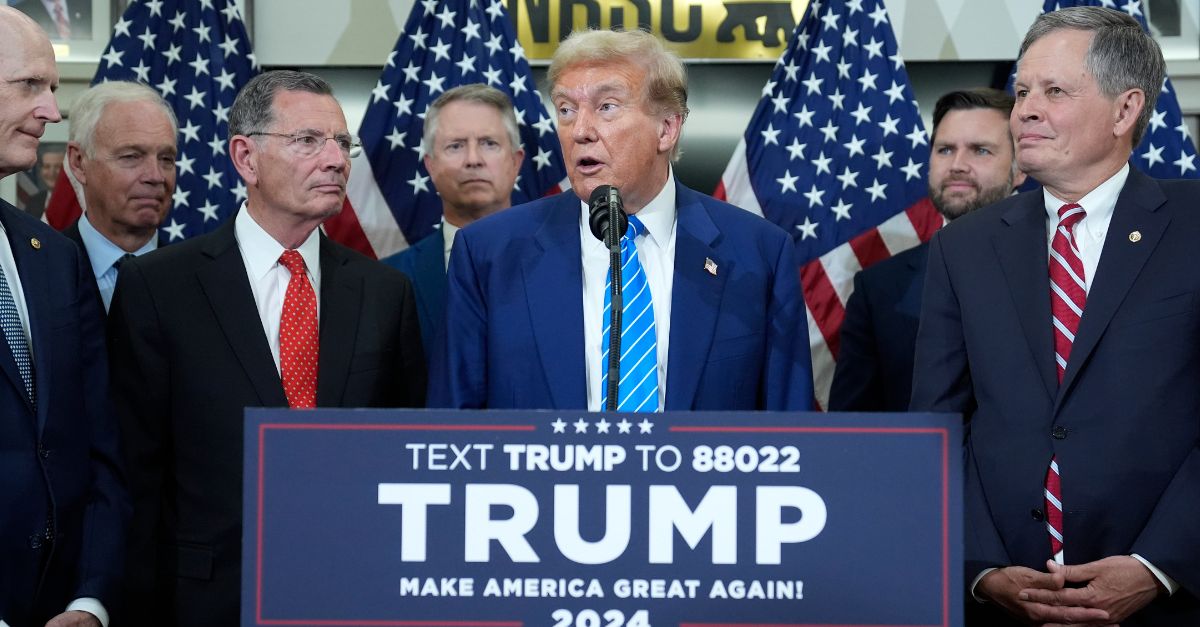 Republican presidential candidate former President Donald Trump speaks with reporters at the National Republican Senatorial Committee, Thursday, June 13, 2024, in Washington, as from left, Sen. Rick Scott, R-Fla., Sen. Ron Johnson, R-Wis., Sen. John Barrasso, R-Wyo., Sen Roger Marshall, R-Kan., Sen. J.D. Vance, R-Ohio, and Sen. Steve Daines, R-Mont., listen. (AP Photo/Evan Vucci)