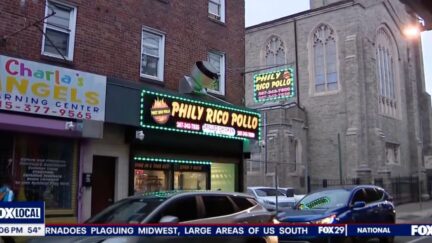 The Frankford apartment building where the 21-year-old victim was found above several businesses (WTFX/YouTube).