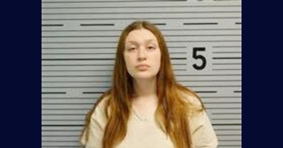 Samantha Woods appears in a booking photo.