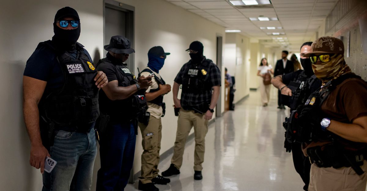 ICE agents in a New York City courthouse.
