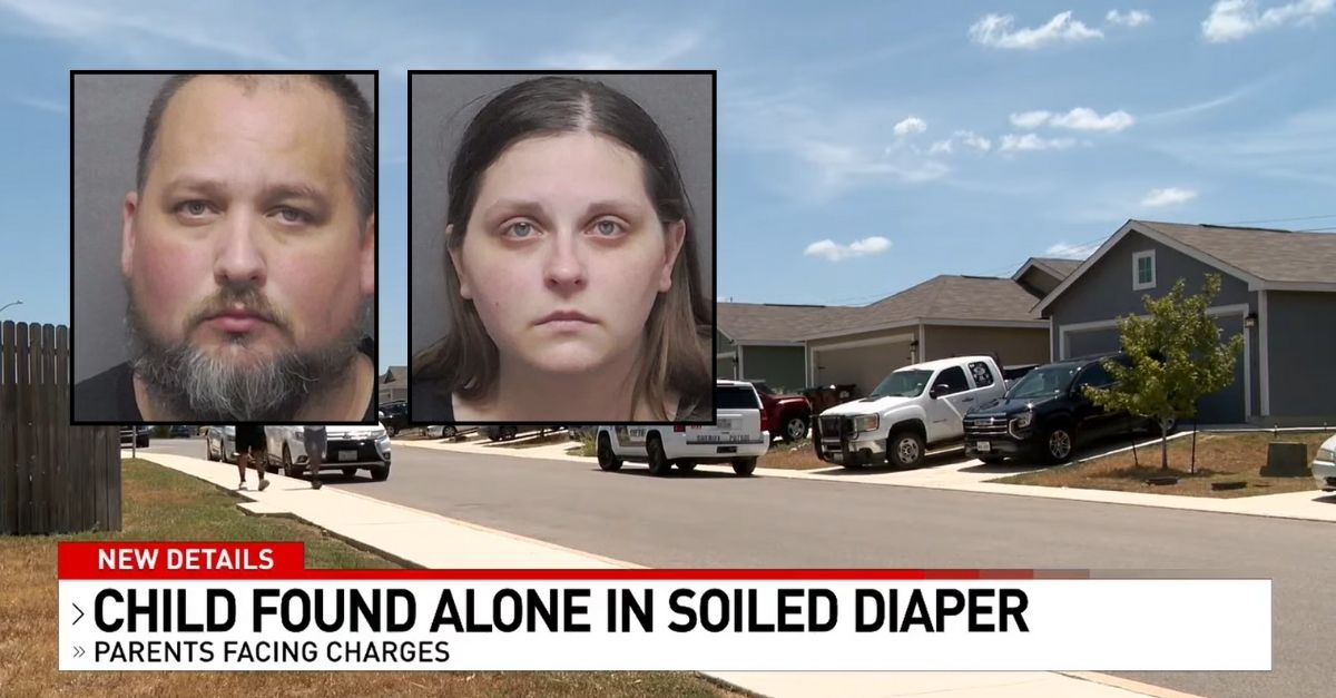Couple arrested after 2-year-old was found roaming street alone