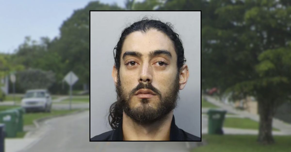 Man allegedly threatened woman while she backed into her driveway