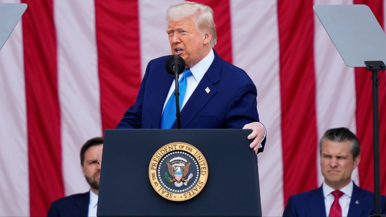 President Donald Trump delivers the Memorial Day Address at the 157th National Memorial Day Observance at Arlington National Cemetery, Monday, May 26, 2025, in Arlington, Va., as Vice President JD Vance and Secretary of Defense Pete Hegseth, right, look on (AP Photo/Julia Demaree Nikhinson).