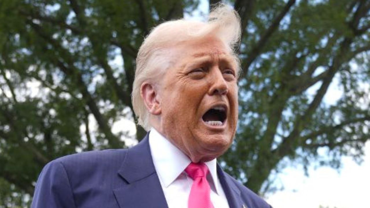President Donald Trump speaks to the media as he leaves the White House, Tuesday, July 15, 2025, in Washington, as White House press secretary Karoline Leavitt, looks on (AP Photo/Manuel Balce Ceneta).